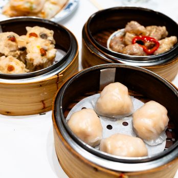 Yank Sing signature dishes Shanghai Dumplings, Peking Duck by the Slice, Scallop Siu Mai, Egg Custard Tarts